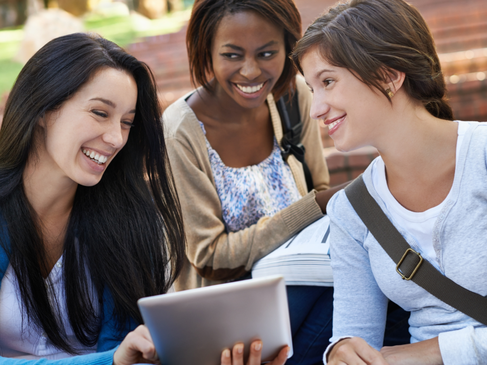 Medical Schools That Accept Gap Year Students Three friends enjoying a tablet together