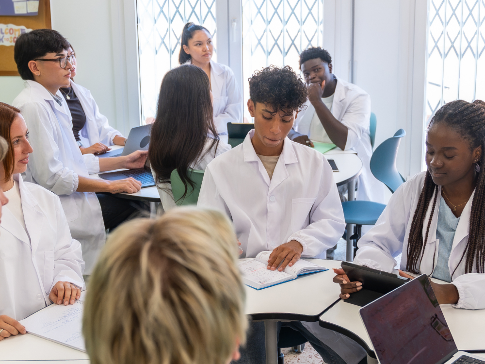 Diverse group in medical discussion.